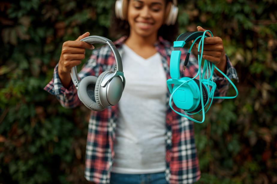 Music fan in headphones listening to music in park