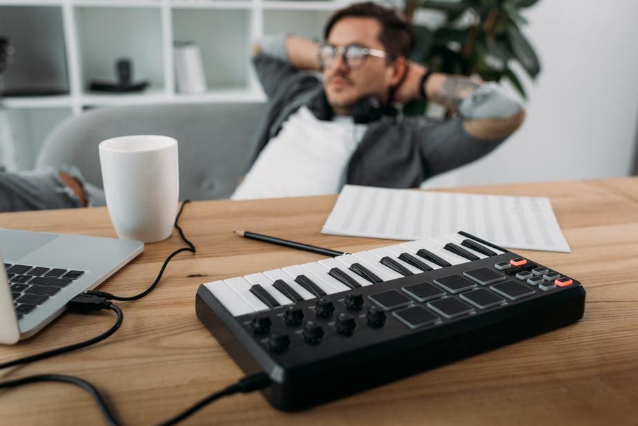 young handsome musician relaxing at modern office