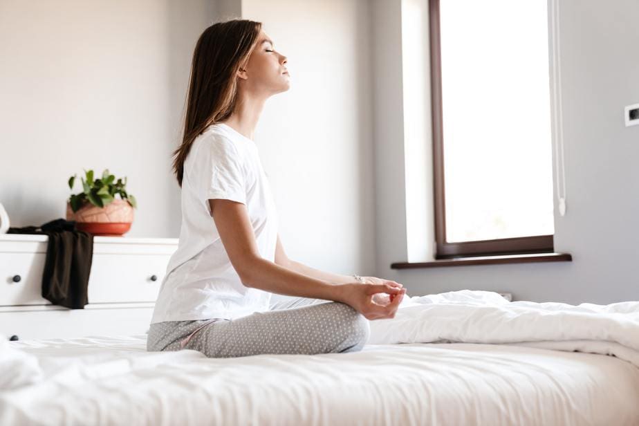 Young woman meditating with closed eyes